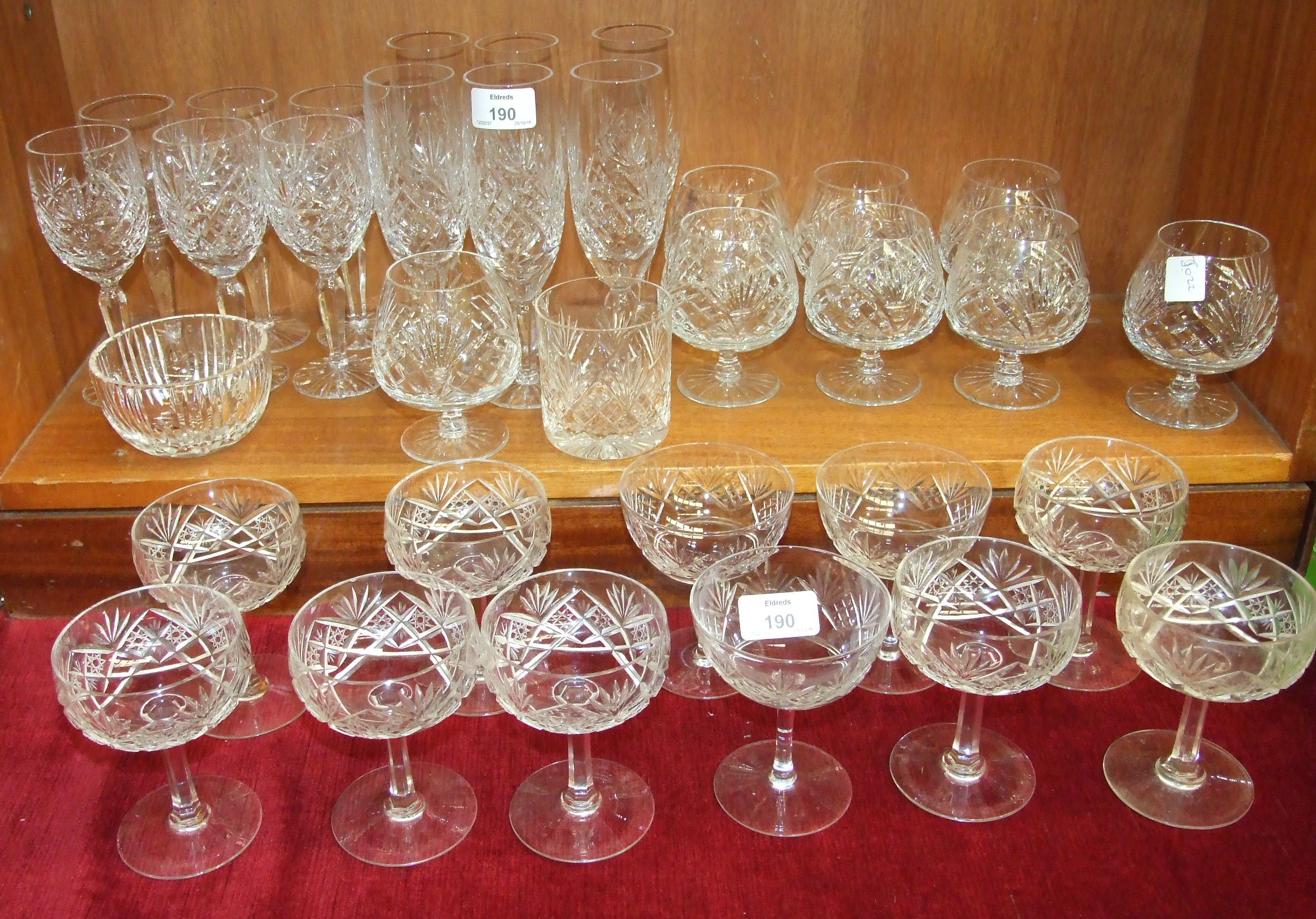 A part-suite of cut glass drinking glasses, including six wines, six Champagne flutes, eight small