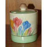 A Clarice Cliff preserve pot and cover decorated in the crocus pattern, factory mark and facsimile
