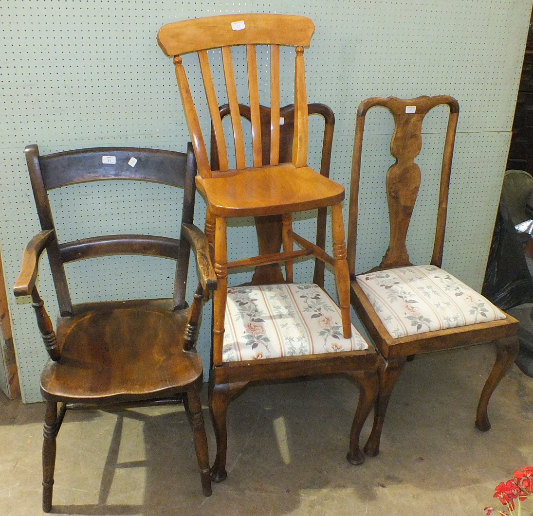 An elm and beech kitchen armchair and other chairs.