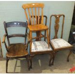 An elm and beech kitchen armchair and other chairs.