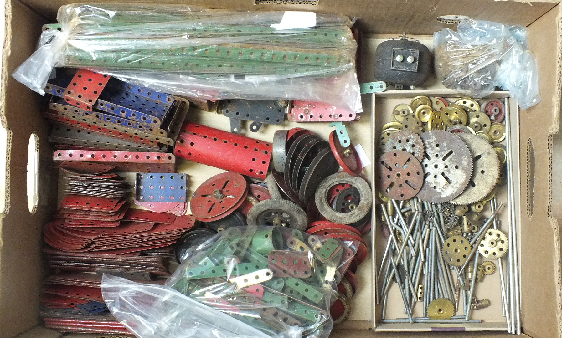 A quantity of Meccano, mainly red, blue and green, including two C/W and one electric motor.