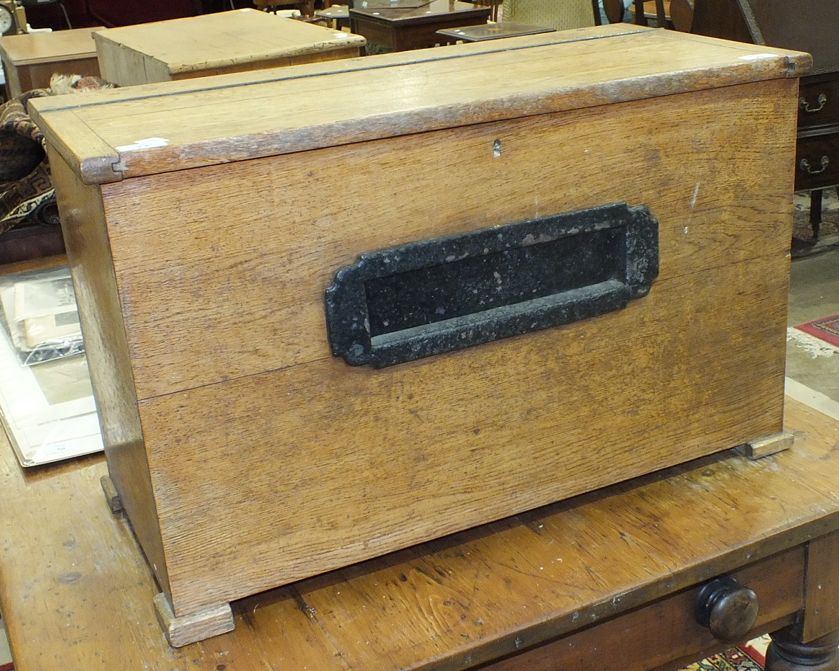 A rectangular oak post box with lockable lift lid, 73cm wide, 47cm high.