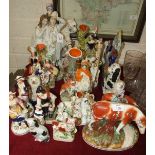 A large collection of Staffordshire figures, animals, spill holders, (many restored).