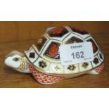 A Royal Crown Derby Imari pattern tortoise paperweight, (white stopper).