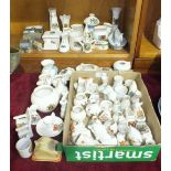 A collection of sixty-six pieces of various crested ware and nine Wade buildings.