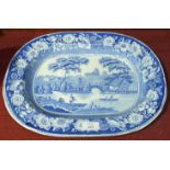 A late-19th century blue and white meat plate in the 'Wild Rose' pattern with river landscape,