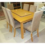 A modern light wood dining table with extra leaf, 194cm wide (extended), 95cm deep and six high-back