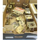 A collection of clock spares, including seven brass carriage clock cases with part-movements, etc.