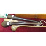 A Masai wooden throwing club, 48cm and three later hardwood clubs, (4).