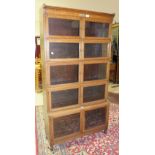A Minty Ltd oak five-tier bookcase in the Globe Wernicke style, each tier fitted with a pair of
