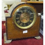 An oak-cased dome-top chiming mantel clock with visible escapement, 31cm high, 32cm wide, (case a/