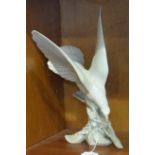 A Lladro figure of a Dove, 29cm high.