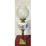 A Late-Victorian oil lamp, the opaque white glass reservoir painted with a house and trees.