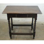 An antique oak sideboard, the rectangular top above a frieze drawer on bobbin-turned legs joined