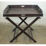 A late George III Mahogany butlers tray and folding stand, 78cm wide.