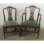 A set of eight Chippendale style mahogany dining chairs with pierced vase splats and drop-in seats