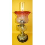 A late-Victorian oil lamp, the faceted clear glass reservoir fitted with Hinks & Son burner, on