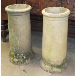 A pair of earthen ware chimney pots, 62cm high.