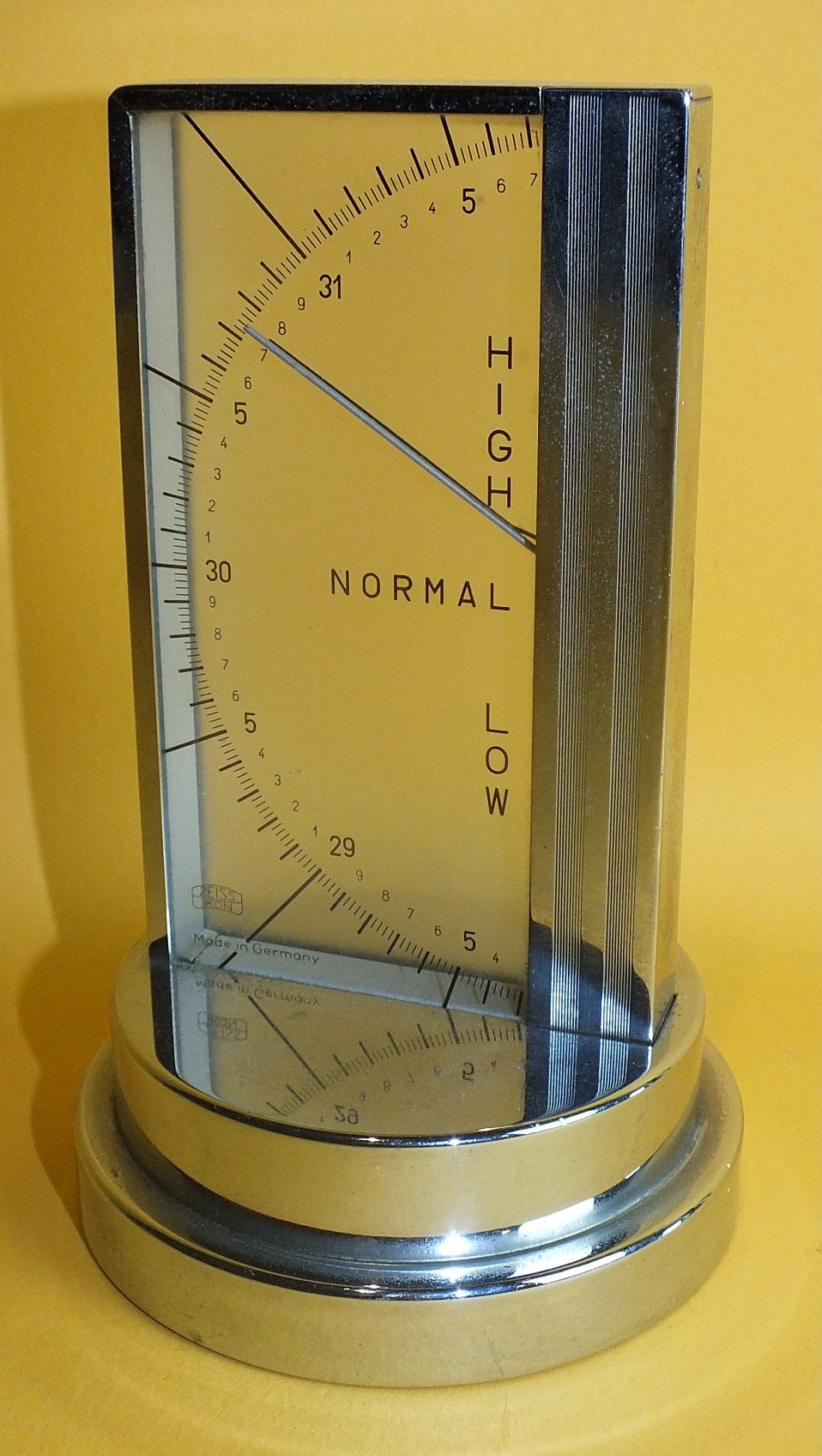 A 1950's Zeiss Ikon chrome-cased desk barometer, 16cm high.