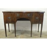 A Georgian style serpentine mahogany sideboard, fitted with three drawers, on square tapered legs