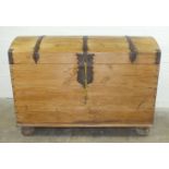 An antique Continental large domed chest, the brass bound hinged lid enclosing a candle box, with