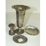 A silver octagonal spill vase, Birmingham 1912 (af), a silver pepper grinder, Birmingham 1916, and