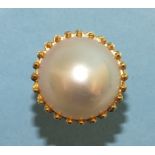 An 18ct gold ring claw set a large mabé pearl, 1.9cm diameter, size N½ , 10.2g.