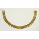 A yellow gold chain bracelet of fancy links, marked 750, 16.5g.