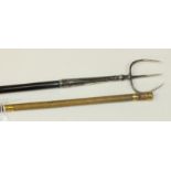 An ebony toasting fork with plated mounts and hanging ring, 80cm long, and a riding crop with yellow