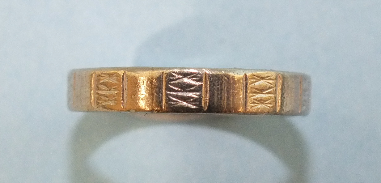 A white metal wedding band with Oriental hallmarks, size P, (tests as platinum), 6.3g.