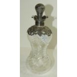 A small pinched glass decanter with pierced silver mounts, marks rubbed.