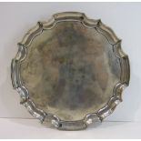 A silver card tray with Chippendale border on three scroll feet, Sheffield 1951, 20.5cm