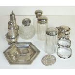 A pair of silver salt and pepper pots with gadrooned rims, Sheffield 1935/6, four silver topped