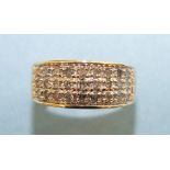 A 9ct gold ring pavé set a panel of twenty seven 8/8 cut diamonds, size K½, 27g.