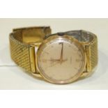 A gent's 'Alpha Super' Antimagnetic wrist watch, the gold face with baton and Arabic numerals, in
