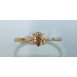 A solitaire diamond ring claw set an old brilliant cut diamond of approximately 0.5cts in 18ct