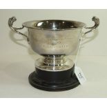 A silver two-handled pedestal trophy cup engraved "Old Surrey & Burstow Point to Point 1957