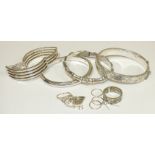 An Emporio Armani silver gate link bracelet, a Links of London silver hinged bangle, two other