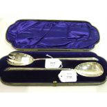 A cased pair of late Victorian silver salad servers of plain form by William Hutton & Sons Ltd,