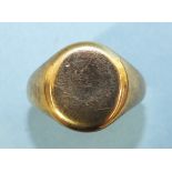 A 9ct gold signet ring of plain form, size O½, 9g.