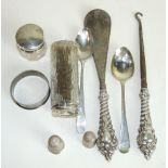 A silver handled shoehorn and matching button hook, Birmingham 1907, two small dressing table silver