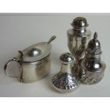 Two Victorian silver pepper pots, another marked Sterling and an oval silver lidded mustard, (