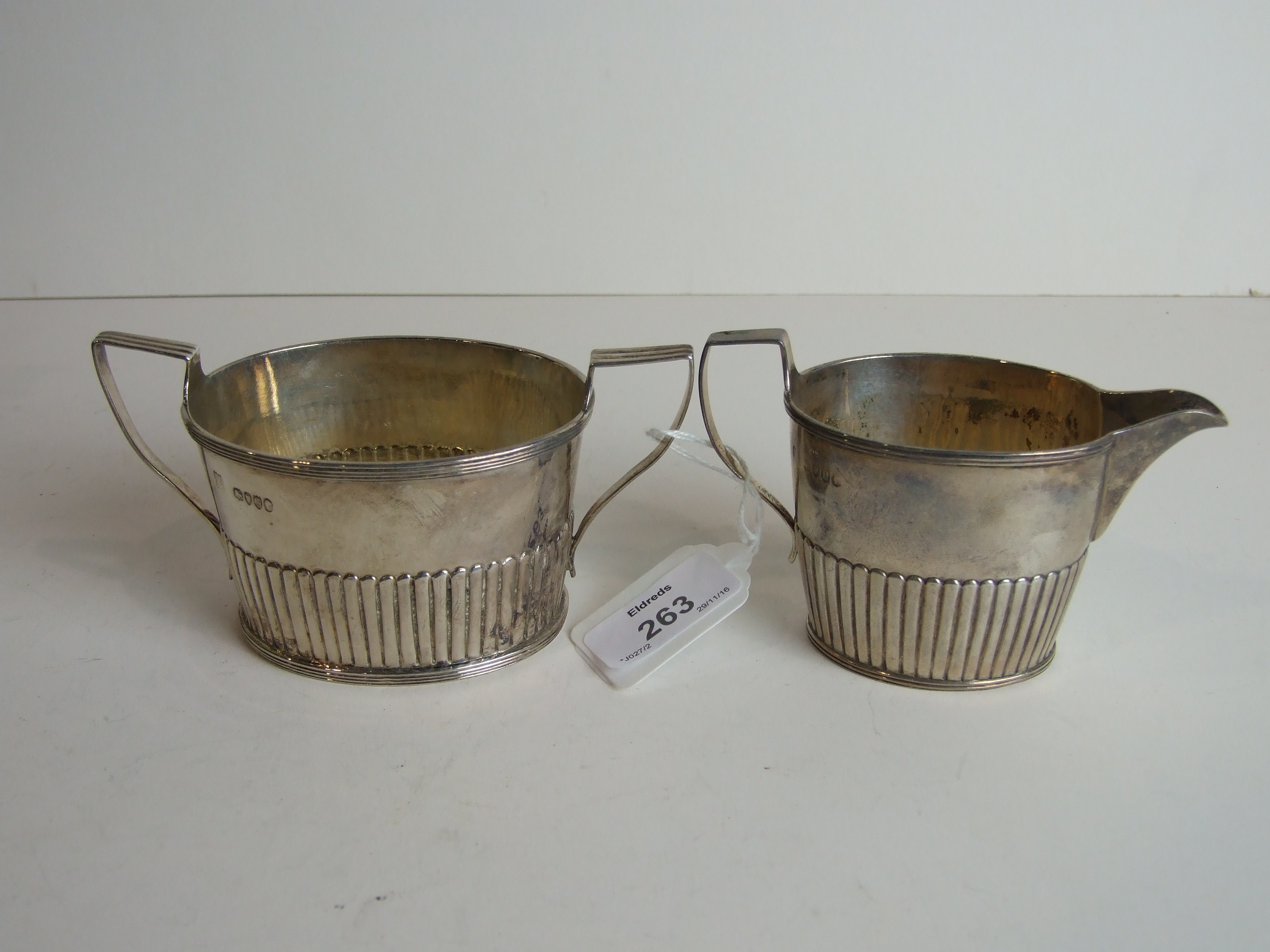 A Victorian silver sugar basin and cream jug of tapered half reeded form, London 1882/3___8.5oz. - Image 2 of 2