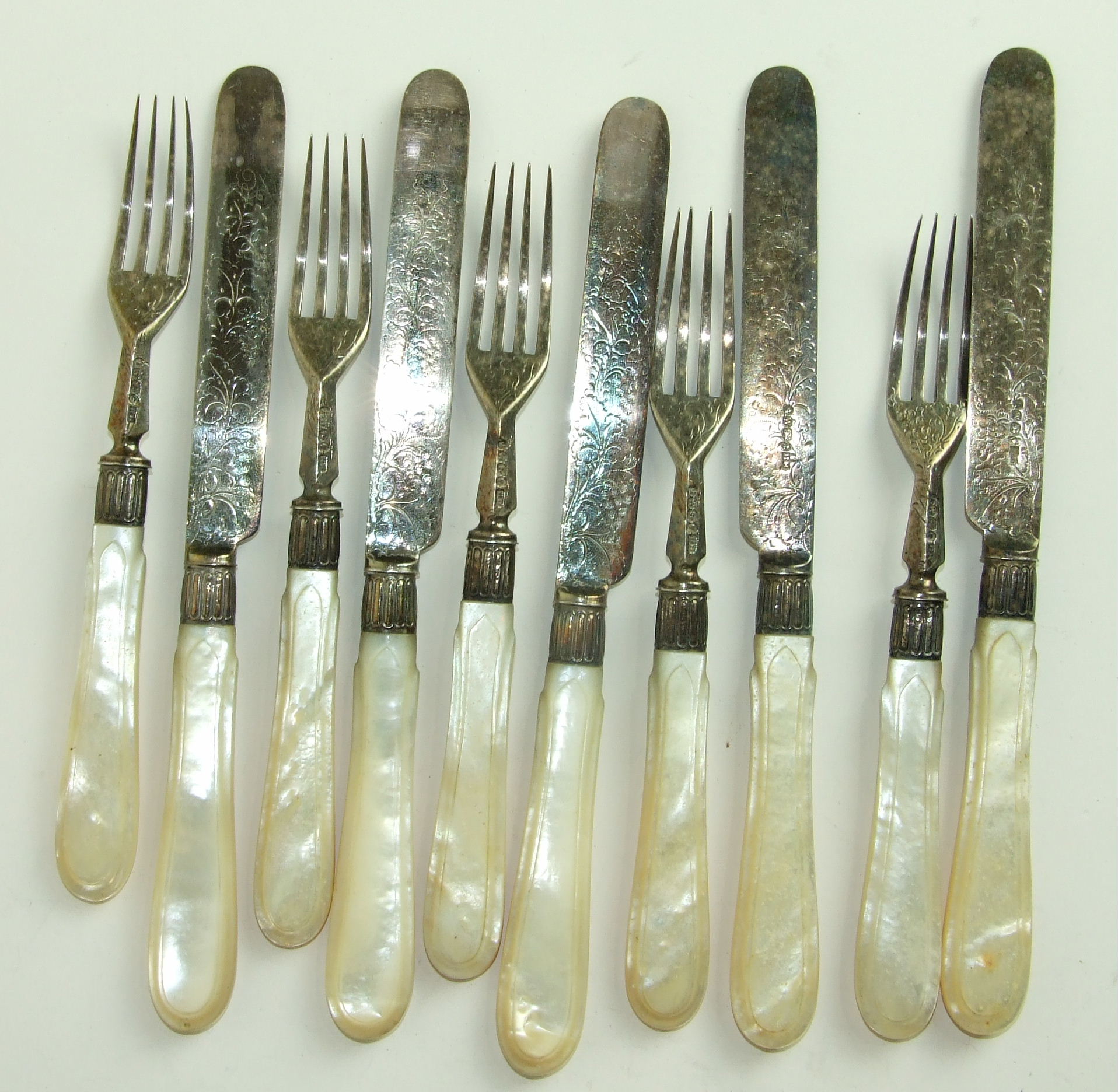 Five each Victorian mother of pearl handled silver dessert knives and forks, Sheffield 1889. (10).