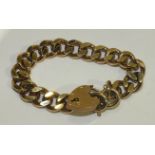 A 9ct gold solid curb-link bracelet with padlock clasp, 56g.