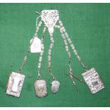 A silver plated chatelaine with five mask-link chains supporting two notebooks, Vesta, button