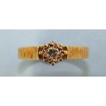 An 18ct gold ring illusion-set a brilliant-cut diamond, size O, 4g.