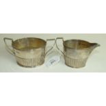 A Victorian silver sugar basin and cream jug of tapered half reeded form, London 1882/3___8.5oz.