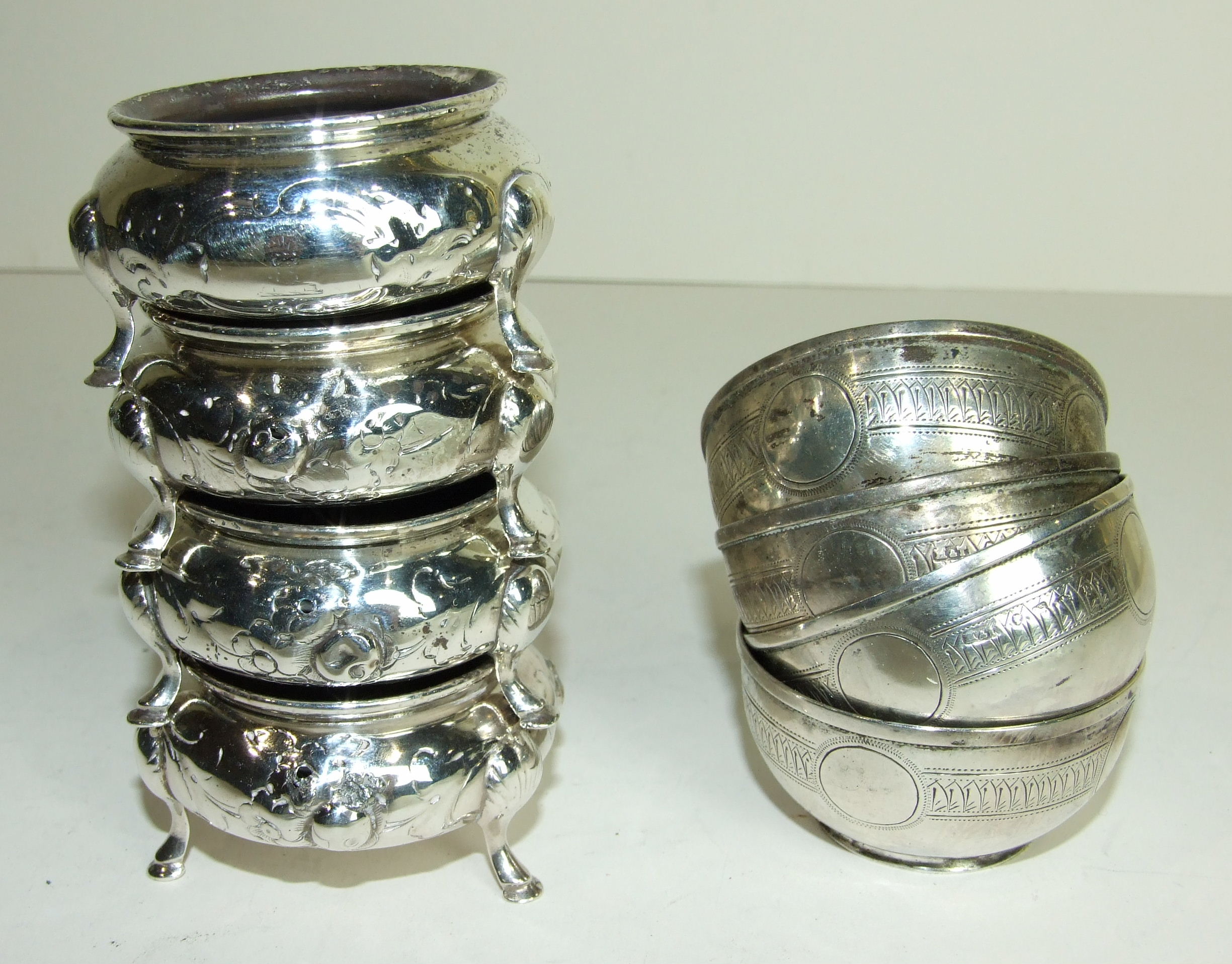 A set of four Victorian silver salts of bowl form with engraved decoration, Birmingham 1881 and