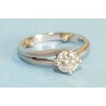 A modern solitaire diamond ring, the brilliant cut diamond of approximately 0.9cts in satin finished